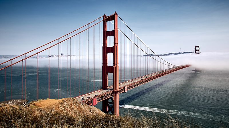 Golden Gate Bridge against a misty blue sky in San Francisco, California, USA